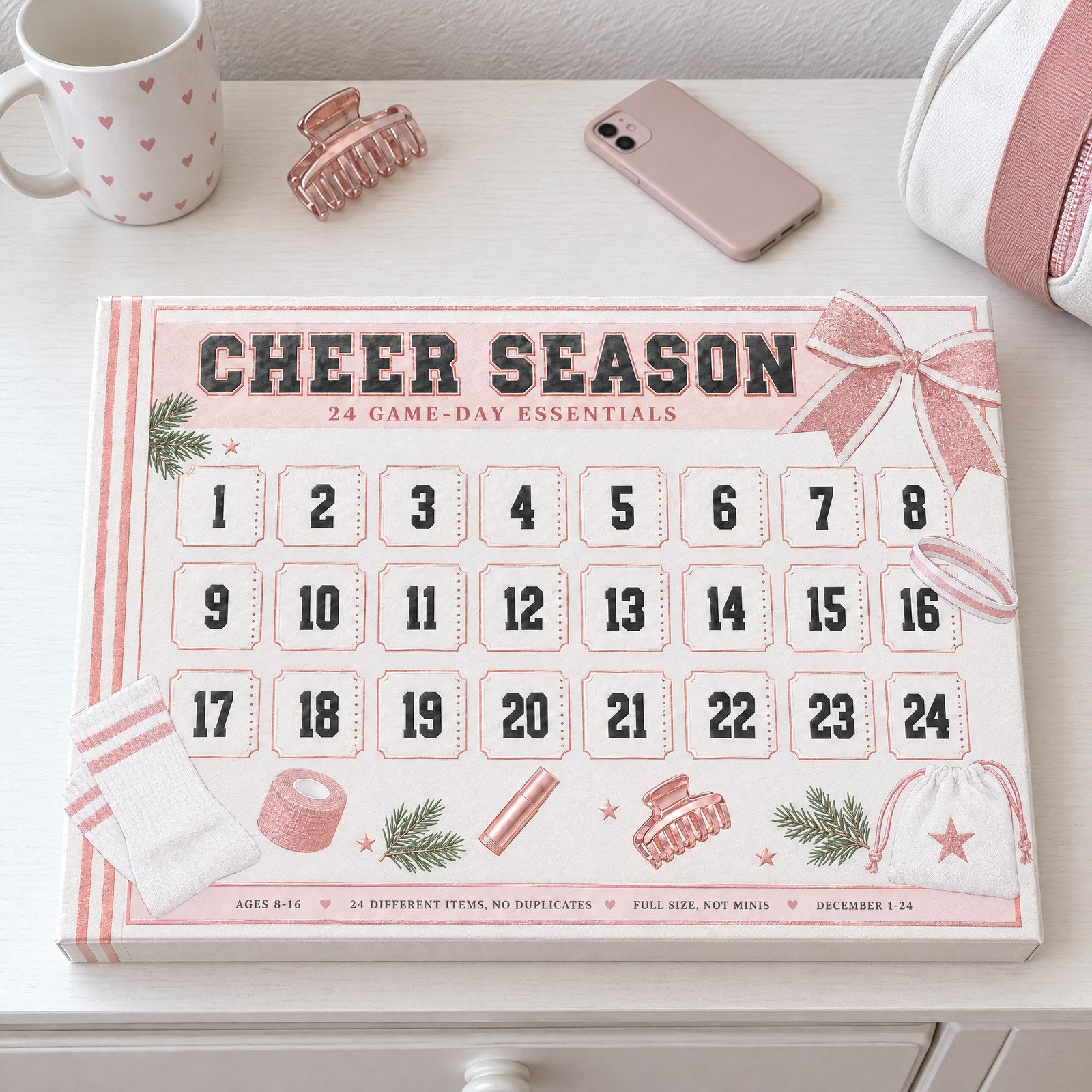 The Cheer Season box closed on a white dresser next to her cheer bag, claw clip and phone, morning light